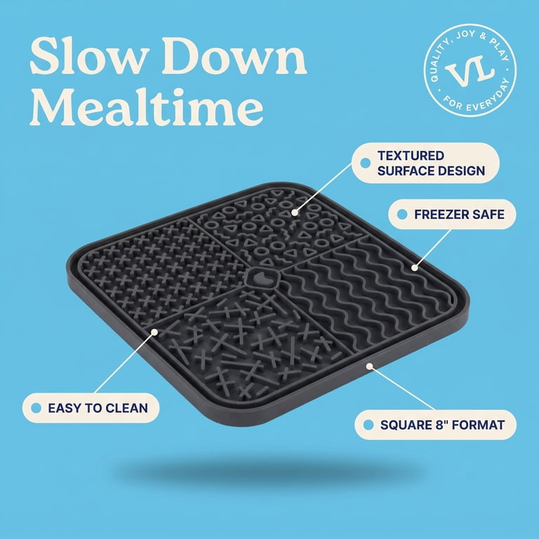 Small dog licking the silicone mat