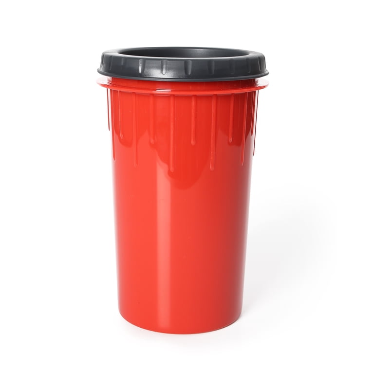Hand holding dog paw cleaner cup